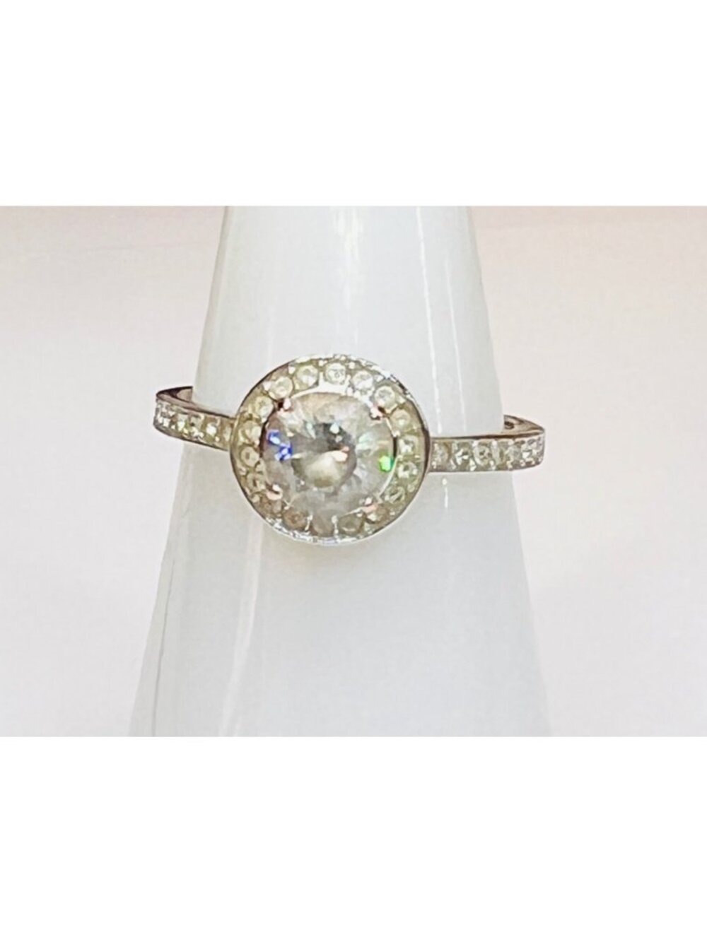 Size 7 ring stamped 55 clear stones silver color  band